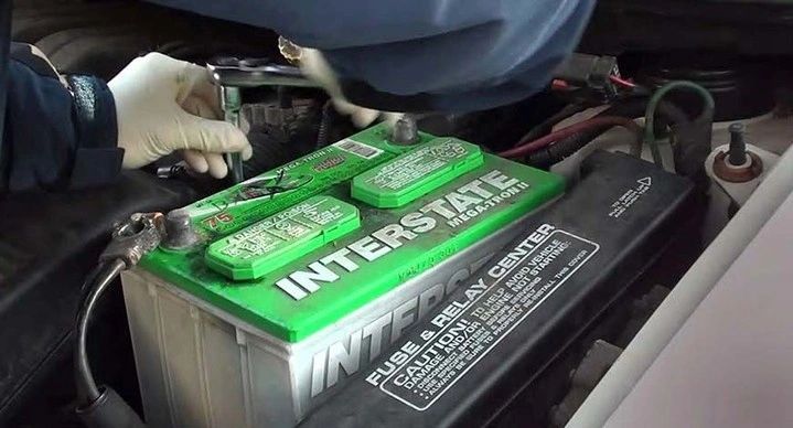 Person installing interstate battery